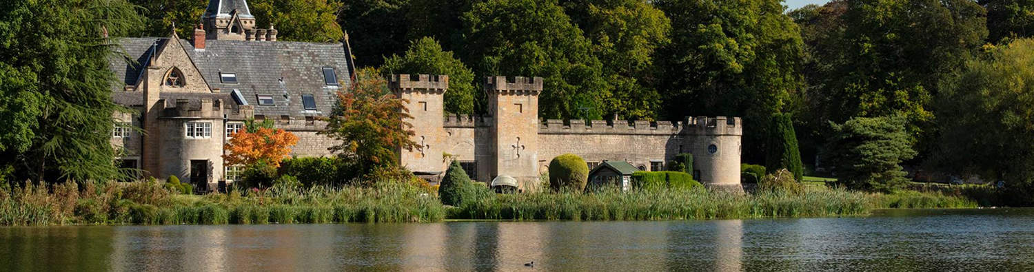 © Historic England Archive. General view of the grounds of Newstead Abbey, showing Cannon Fort from the west, with the upper lake beyond. Nottinghamshire.